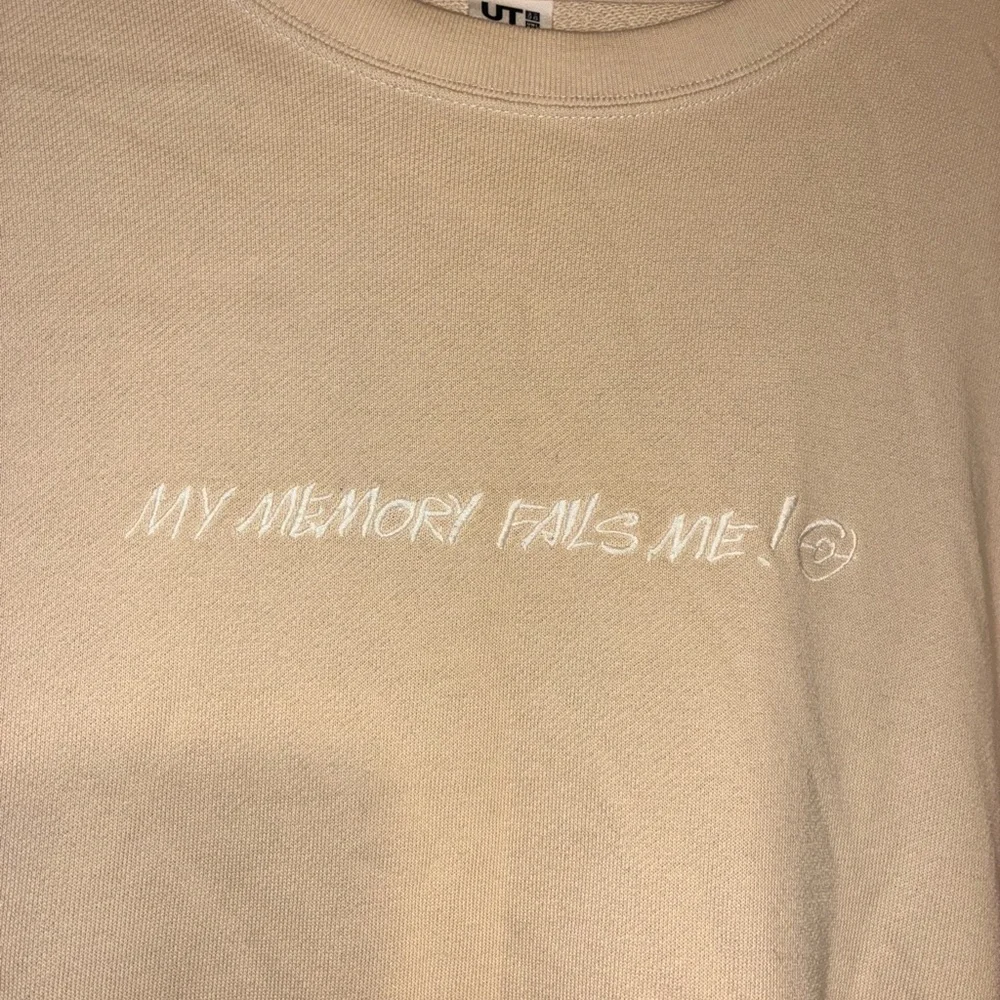 Uniqlo Pokemon x James Jarvis UT Tan My Memory Fails Me Sweater Psyduck Sz L - Picture 5 of 6